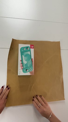 How to gift wrap a Nintendo Switch for Christmas #wrappingpresents #giftwrapping #wrappinghacks #presents | Lennia McCarter