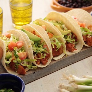 These spicy vegan tacos feature jackfruit, a popular ingredient with plant-based cooks because of its meat-like texture and ability to absorb other flavors. RECIPE: https://www.forksoverknives.com/recipes/vegan-burgers-wraps/chipotle-jackfruit-tacos/ | Forks Over Knives