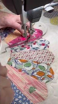 Dresden plate quilt with ruler work.