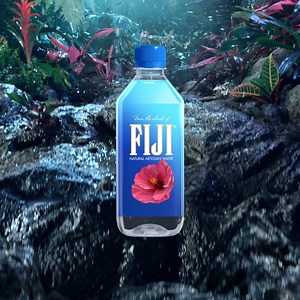 Tropical rain slowly filters through ancient volcanic rock, naturally gathering minerals and electrolytes, giving FIJI Water its signature soft, smooth taste. | FIJI Water