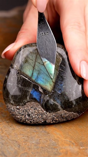 Light moves when pressure softens. ASMR featuring labradorite with copper. The surface fractures to reveal shifting flashes before compressing into a metallic, iridescent cream. Labradorite supports intuition and transition. The collapse represents letting hidden layers surface gently. #asmr #labradorite #crystalhealing #aiasmr #asmrnotalking