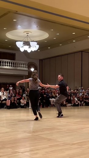 Modern Swing Dance Couple Demonstrates Shoulder Roll Improvisation