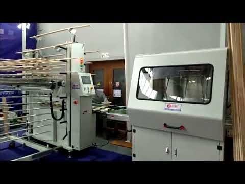 Linear spray paint machine with the automatic unloading device
