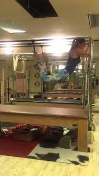 Flying squirrel on the Cadillac. An advanced Pilates exercise.