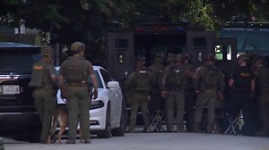 Heights SWAT standoff ends with woman shot by police