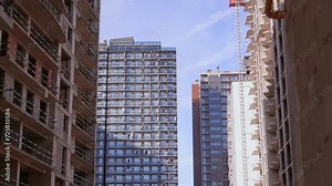 Modern high-rise residential buildings. Construction of new quarters. Building. modern residential apartments with facade of apartment buildings. Detail of unfinished buildings, development of area.