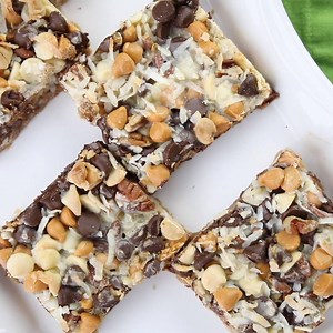 176K views · 350 reactions | Seven Layer Bars, Magic Cookie Bars, Kitchen Sink Bars -- whatever you call them, this classic dessert is easy and delicious. A graham cracker crust, chocolate, white chocolate, and butterscotch chips, nuts, and shredded coconut are melded together with sweetened condensed milk. RECIPE ---> https://www.dessertnowdinnerlater.com/seven-layer-bars/ | Dessert Now, Dinner Later | Facebook
