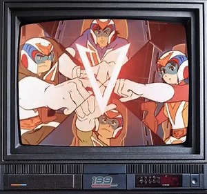 Let's Volt In! Steve pilots the Volt Crewzer, Mark the Volt Bomber, Big Bert the Volt Panzer, Little Jon the Volt Frigate and Jamie the Volt Lander. When they need an extra boost, the machines fly into V formation and crying out, “Let’s Volt in!” The machines, using ultra-electromagentic energy, transform and join together, becoming the robot Voltes V. Steve, whose cockpit moves into the robot’s eyes, is in command. | 199_