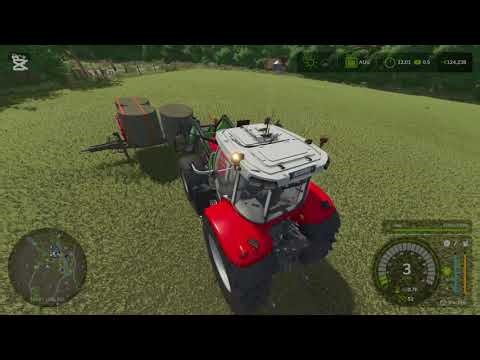 Cutting grass picking up hay bales in daheim