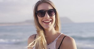 Girl at beach with smile - Non-graded version