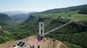 This dizzying glass-bottom bridge lets you see through to the ground 500 feet below