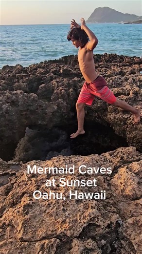 Mermaid Caves are beautiful hidden sea caves and lava tubes on the west coast (near Nanakuli/Waianae) accessible only during low tide, where sunlight streams through holes in the lava rock. They can be dangerous and require caution due to sharp rocks and sudden wave surges. Visitors must navigate lava rocks to enter through a natural hole and need upper body strength to climb out, making sturdy shoes and good ocean awareness crucial for a safe visit, with signs warning of past fatalities. It is 