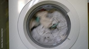 Modern washing machine, Clothes washing machine in laundry, Laundry being done at home.