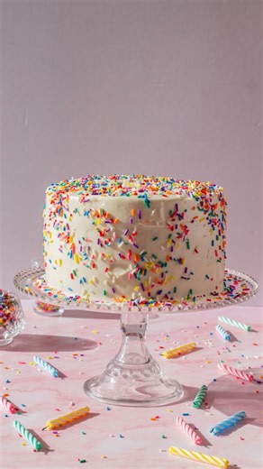 Maddie & Jules on Instagram: "The ultimate celebration cake. Three layers of funfetti vanilla cake dotted with sprinkles topped with luscious cream cheese icing finished with more sprinkles. No party is complete without this cake. For full funfetti cake recipe comment “recipe” or visit link in bio. . . . #cake #cakereels #cakerecipe #funfetti #funfetticake"