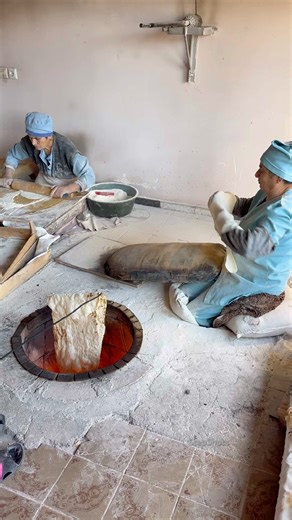 How experienced women bake Armenian Lavash bread in wooden oven tonir