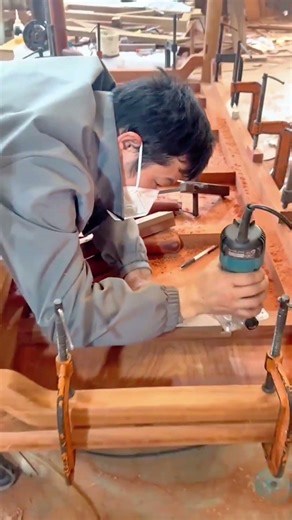 manual carving of traditional wooden tables using a drill tool for a stronger and neater result