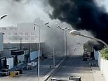 Columns of black smoke rise across Tripoli as fighting intensifies
