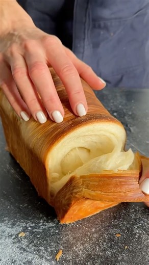 Nourishing on Instagram: "A recipe I come back to again and again. Croissant Loaf 🥐✨ (via: @natashas_baking) Flaky like a croissant, sliceable like a loaf, and baked to golden perfection. Same method, better bake — this croissant loaf is pure laminated comfort. 🤍 🛒 Ingredients (for loaf pan 8.27 × 4.80 × 4.53 in / 21 × 12 × 11.5 cm) Dough • 280 g bread flour • 33 g sugar • 5 g salt • 30 g soft unsalted butter • 4 g dry instant yeast • 15 g egg • 145 g milk Roll-in Butter • 125 g unsalted butt
