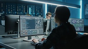 clip-1024519511-smart-female-programer-working-on-desktop-computer