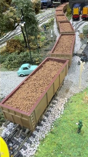 Invacar is passed by a weathered class 90 pulling ore.