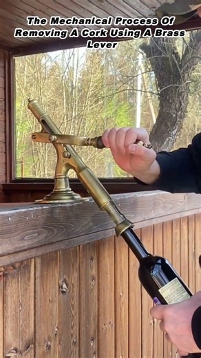 The Mechanical Process Of Removing A Cork Using A Brass Lever