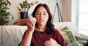 Face, therapy and woman with eft tapping on sofa for anxiety, mental health and holistic healing. Video call, portrait and Asian life coach on virtual consultation for facial energy reiki at home.