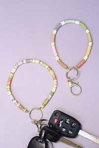 These clay beaded keychain wristlets are fun, useful, and giftable! Been using mine almost daily for a few months already and I am so excited to finally have the tutorial ready. Tutorial https://www.momsandcrafters.com/beaded-wristlet-keychain-tutorial/ #beadedkeychain #beading #diyaccessories | Moms & Crafters