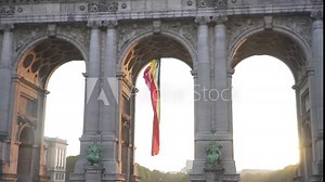 Belgium flag against tricolour stripes waving on wind from Arcade du Cinquantenaire 1920X1080 HD footage (1080p 100fps FullHD video)