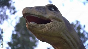 The head of the brachiosaurus opens its mouth and moves from side to side, one of the largest. He lived at the end of the Jurassic period. High quality 4k footage
