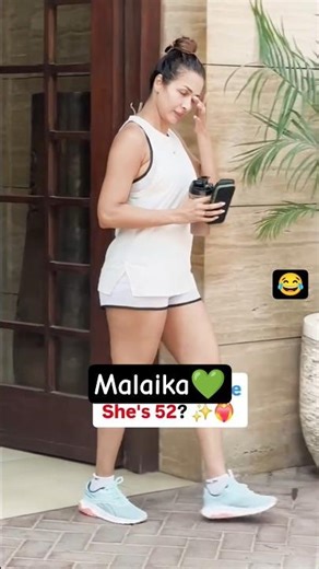 Malaika arora spotted benath building going to gym with bootle #malaikaarora #gym #whiteoutfit #love