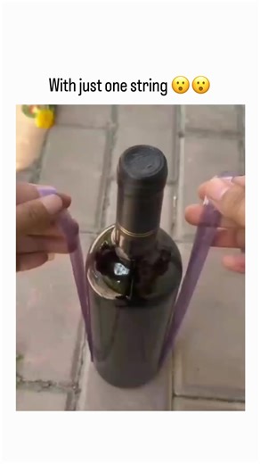 Global Reels Hub on Instagram: "The post features a 10-second video demonstrating a clever technique to secure six wine bottles together using a single purple string looped around their necks in a crisscross pattern, leveraging tension for stability without a carrier bag. Posted on December 26, 2025, it quickly went viral with over 1.1 million views and 6,400 likes, drawing replies in multiple languages praising the hack's ingenuity and the string's durability. This holiday-timed clip highlights
