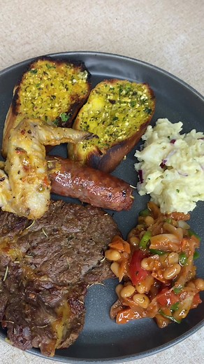 Delicious Sunday Braai Plate with Garlic Bread, Steak, Wors, and More