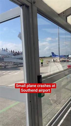 Watch as a huge plume of black smoke is seen rising from outside Southend Airport, after a small plane crashed and erupted into a fireball | The Independent