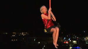 CNN reporter lifted by crane onto yacht on NYE