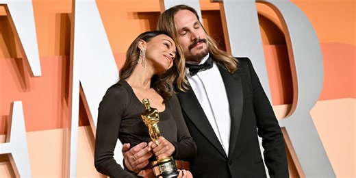 Zoe Saldaña and Husband Marco Perego Saldaña Cuddled Up at the Vanity Fair Oscar Party