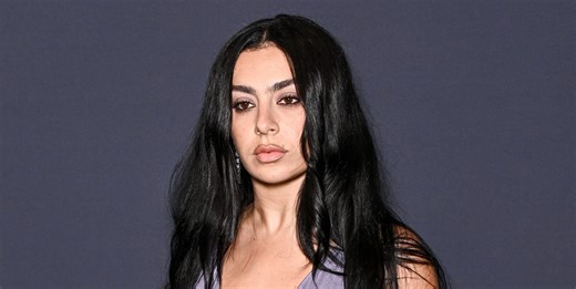 Charli XCX Wears Sheer White Wedding Dress With White Panties and Corset