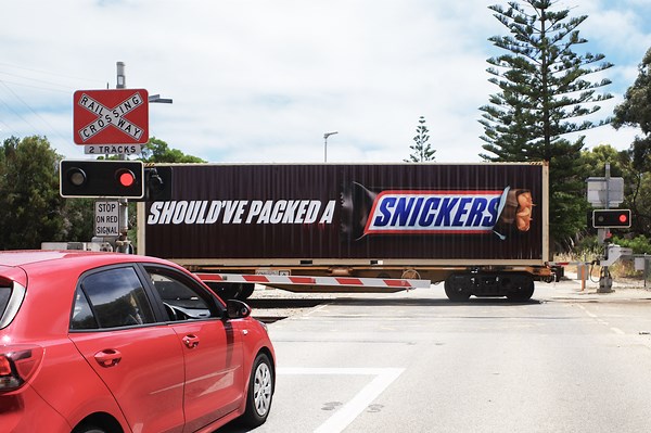 World’s-first SNICKERS® moving billboard on rails, transforms a WA freight train into OOH - T&P - Adforum.com