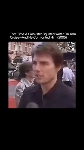 History_Explained_00 on Instagram: "In 2005, a prankster squirted water in Tom Cruise’s face during an interview at the London premiere of War of the Worlds. Cruise stayed composed and immediately confronted the man, calling the act “incredibly rude” and describing it as a “nasty” stunt. The moment drew attention for his calm but firm response, highlighting a clear line between humor and disrespect. Follow (us) @history_explain_00 for more content like this . . . . . . . . #prank #tomcruise #vir