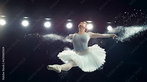 Portrait of a Talented Ballet Dancer Performing on Stage. Young Female Making a Split Leap Jump and Releasing Powder From Her Hands in a Dark Studio. Cinematic Super Slow Motion Speed Ramp Footage