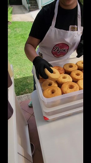 Delicious Dessert Preparation: Donuts with Colorful Toppings