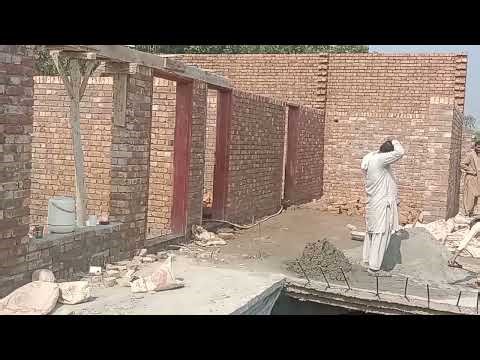 Construction Laborer Working on Traditional Brick Building | On-Site Masonry Work