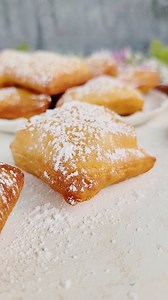 These beignets are super soft, pillowy, and hard to resist! These French donuts are fried until perfectly golden, then generously dusted with confectioner’s sugar. If you love the famous Café Du Monde Beignets, you will love these! Comment recipe for the full recipe to be sent directly to you. You can find the full recipe on my blog simplebakingwithpep.com. https://simplebakingwithpep.com/beignet-recipe/ #beignet #beignets #mardigras #easyrecipe #baking #doughnuts #donut #cafedumonde #neworleans