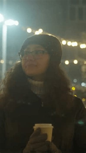 clip-4006831573-woman-walks-amid-holiday-lighting-female-figures