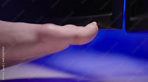 Person foot turn on the computer monitor with big toe toenail close-up 4K Stock Video