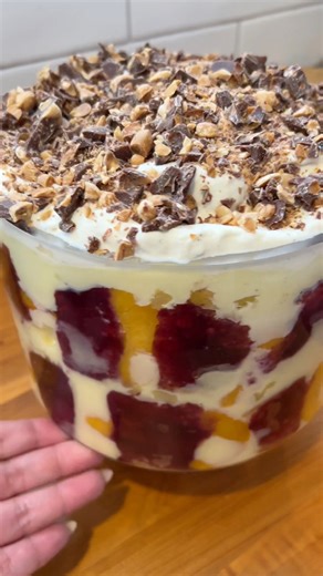 Christmas trifle is a must Ingredients Trifle custard -6 cups milk -6 tosp sugar -1 cup water -8 tbsp custard powder (used Edmonds custard powder) -vanilla paste (optional) -Sponge cake (used large trifle sponge from Woolworths) -1 large can sliced peaches 820g -1 can crushed pineapple 425g -your favourite jam (used black Doris plum jam) Trifle topping -300ml cream -sugar to taste -whittakers peanut slab chocolate grated or finely chopped Method 1. Make trifle custard. Heat milk and sugar. Bring