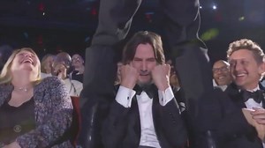 Keanu Reeves left open-mouthed after being straddled by Jonathan Groff