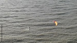 Kiteboarding With Hydrofoil Board - Water Skier Rides A Stand-up Foilboard With A Kite. - aerial