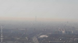 Ostankino TV Tower and beautiful Moscow sunrise panorama with many buildings filmed at high altitude