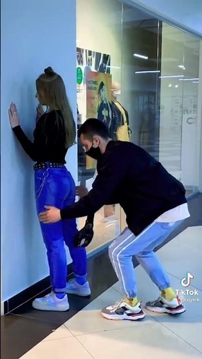 girl gives touch a but on boy hand