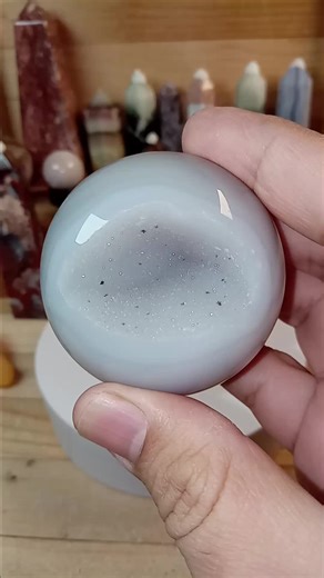 Druzy agate sphere featuring smooth polish and a natural druzy pocket #agatecrystal #sparklycrystals #mineralvideo